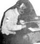 boy at desk with gloves